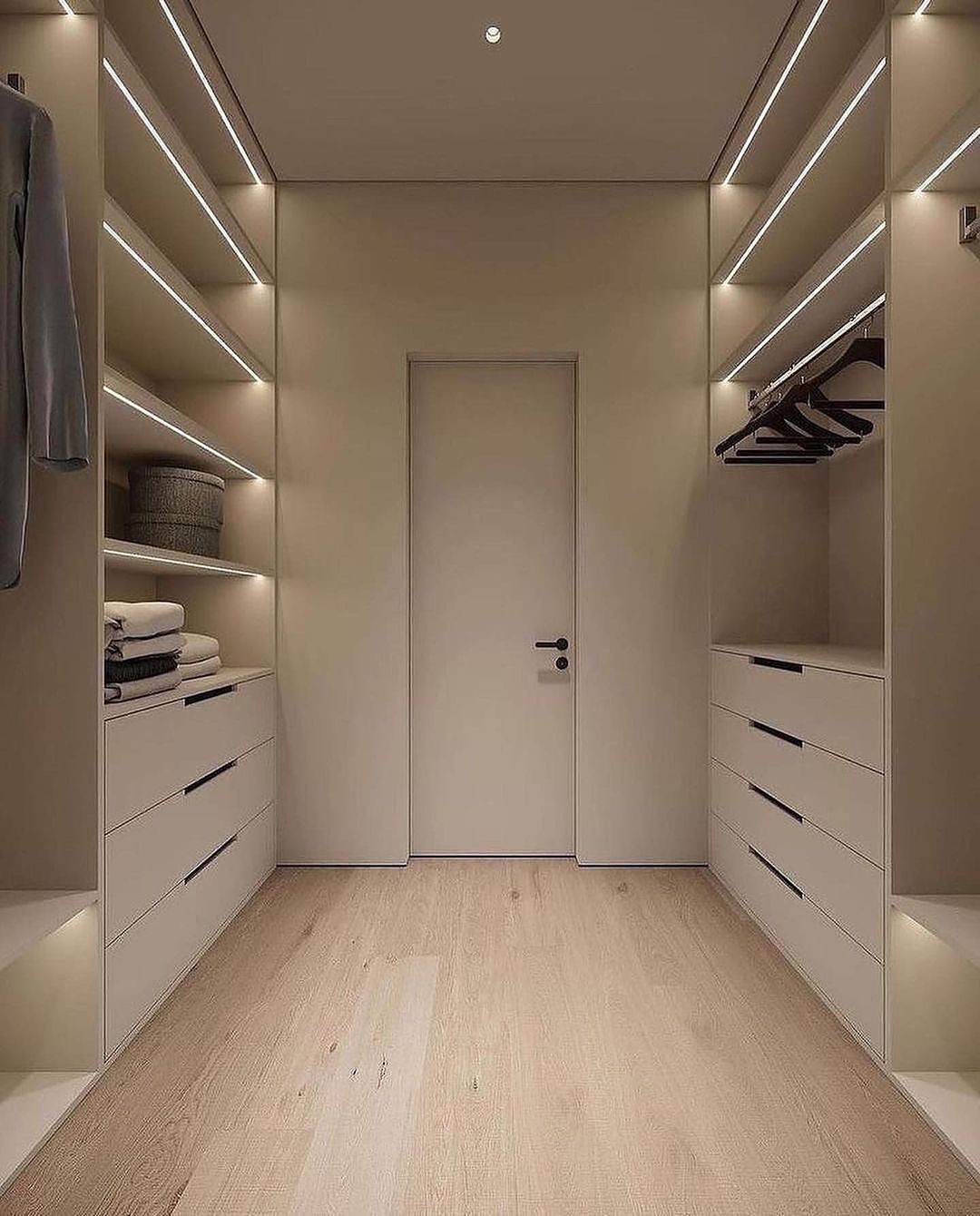 nice and clean walk in closet in white