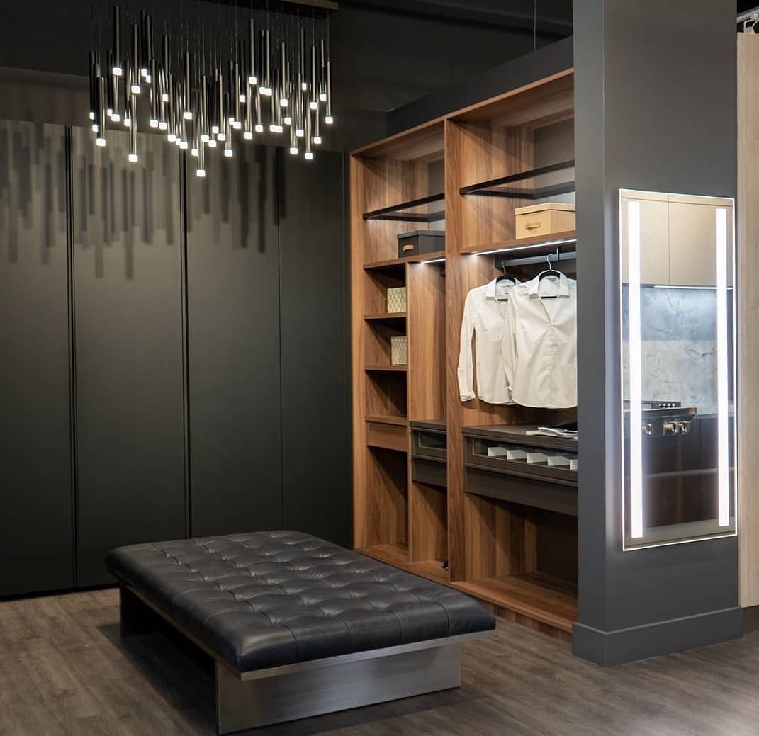 huge walk in closet with black finishes